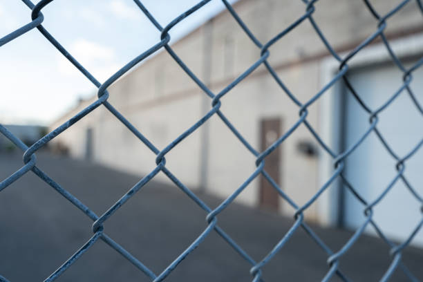 istock Chain link Wire mesh fence fence around a factory 2148278728