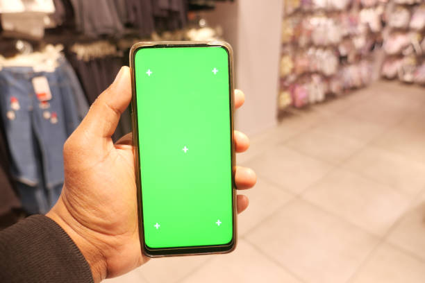 istock holding smart phone with green screen against shopping mall background 2148281271