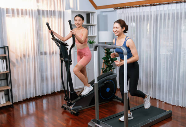 istock Energetic and strong athletic asian woman running on machine. Vigorous 2148281427