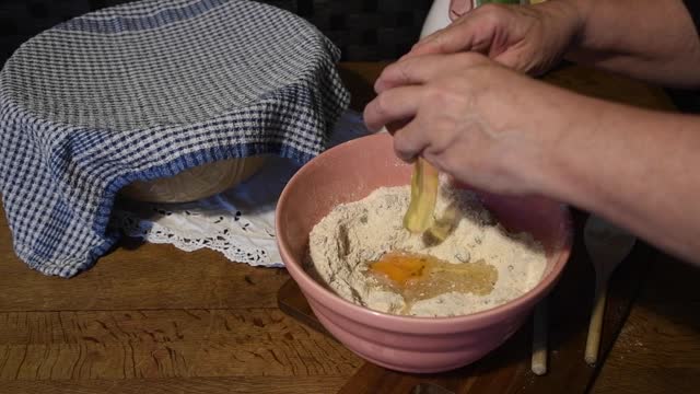 Cracking an  egg  in to a  vintage  bowl