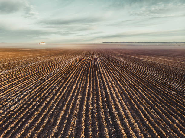 istock A field of dirt with a few clouds in the sky 2148281959