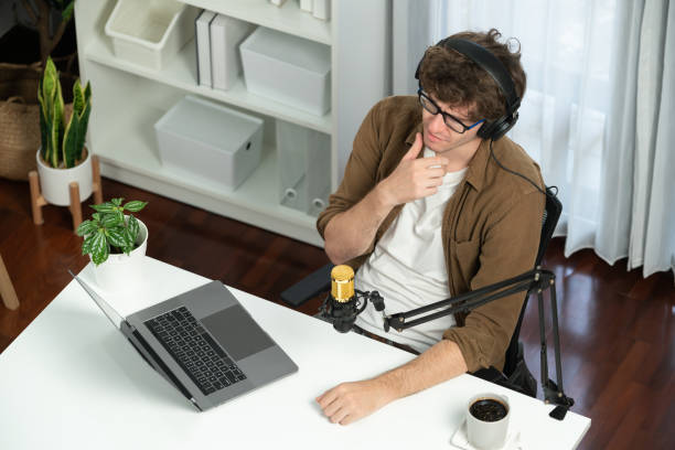istock Influencer using headphone talking with listeners on social media. Gusher. 2148281993