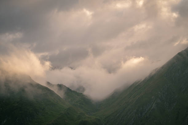 Aerial view of mountains and clouds at sunrise, Swiss Alps