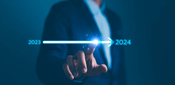 istock Businessman touch on loading progress from 2023 to 2024,Planning and challenge strategy in new year 2024 Concept. New business startup in 2024. New year 2024 is loading, calendar date, end of the year 2148282354