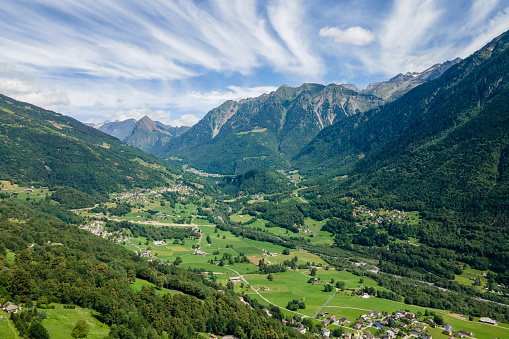 Aerial view of mountain village surrounded by forest, Swiss Alps