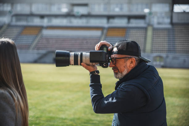 istock Photographer working at a press conference at the stadium 2148284182