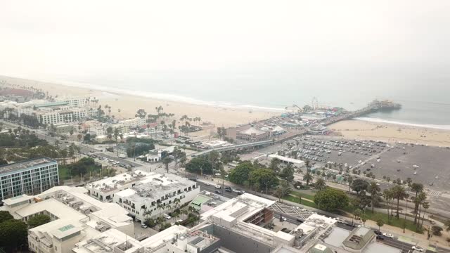 Drone Shot of Santa Monica Pier on the Pacific Ocean in Santa Monica, California on a Cloudy day
