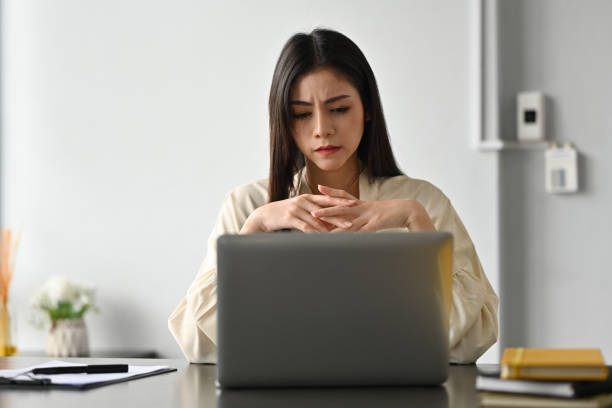 istock Image of frustrated millennial female manager looking at computer screen, think of problem solution. 2148287254