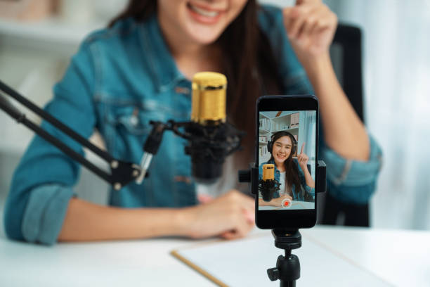 istock Host channel talking in broadcast wearing headset smartphone record. Stratagem. 2148289852