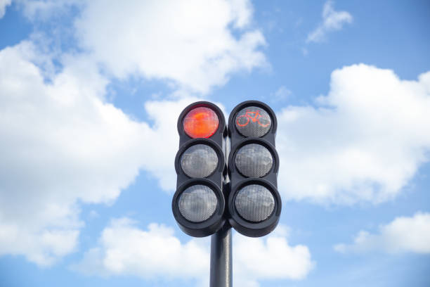 istock the traffic light in the background of blue sky, red light 2148290692