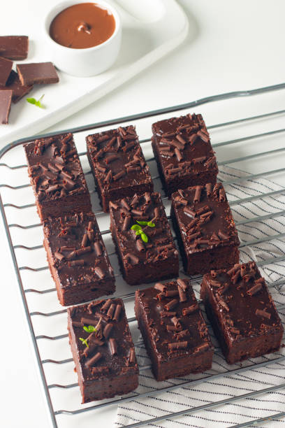 istock Delicious chocolate brownies with mint on white background. Sweet cake concept. 2148291239