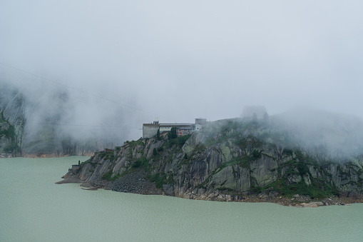 Hydroelectric  power station in Swiss Alps in fog