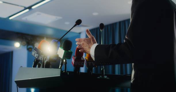 istock Male organization representative pronouncing speech from the tribune 2148292152