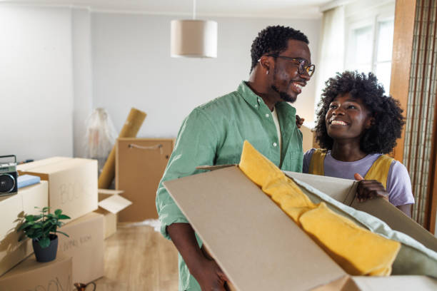istock Home Sweet Home. Happy young couple unpacking 2148293363