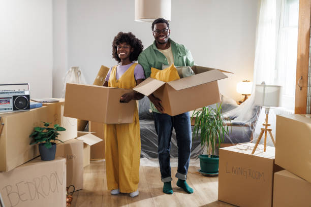 istock Portrait of a young couple unpacking 2148293381