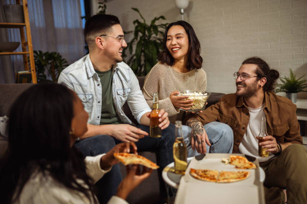 istock Multiracial group of friends having pizza party. 2148293669