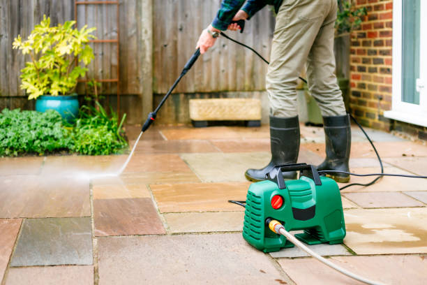 istock Senior man cleaning patio tiles using pressure washer 2148295327