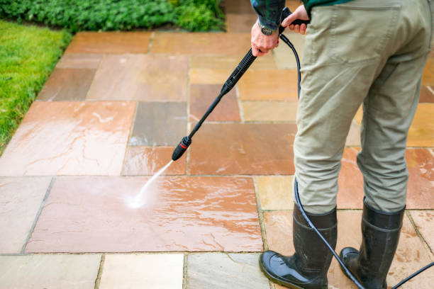 istock Senior man cleaning patio tiles using pressure washer 2148295371