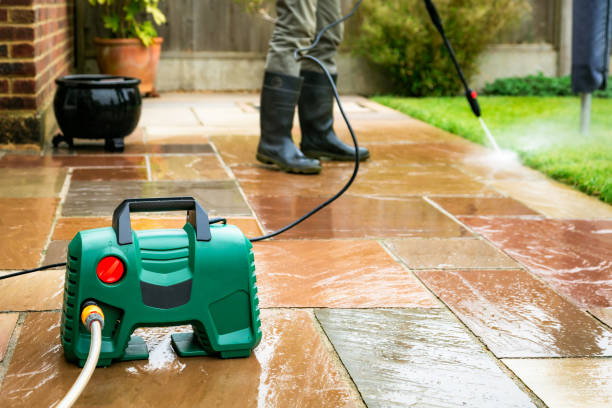 istock Senior man cleaning patio tiles using pressure washer 2148295476
