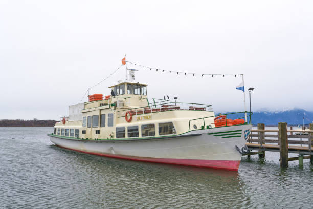Prien, Germany – December 23, 2023: Passenger ship Siegfried of Chiemsee-Schifffahrt Ludwig Fessler KG for the trip to Herreninsel in the harbor of Prien on Lake Chiemsee in Bavaria, Germany
