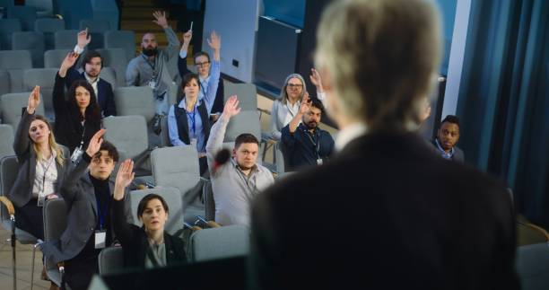 istock Back view of politician or activist pronouncing speech during press campaign 2148298166