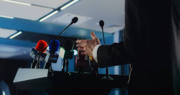 istock Male organization representative pronouncing speech from the tribune 2148298964