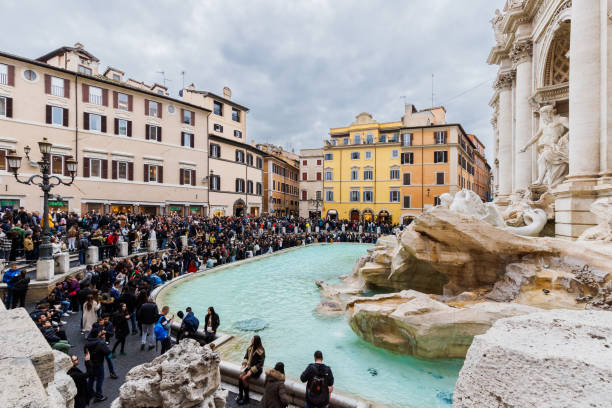 Rome, Italy - December 29, 2023: Trevi Fountain in Trevi Square (Piazza di Trevi) in the historic city center visited by tourists on a winter day
