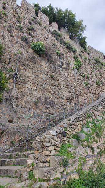 istock ancient high stone fortress wall with stairs 2148300645