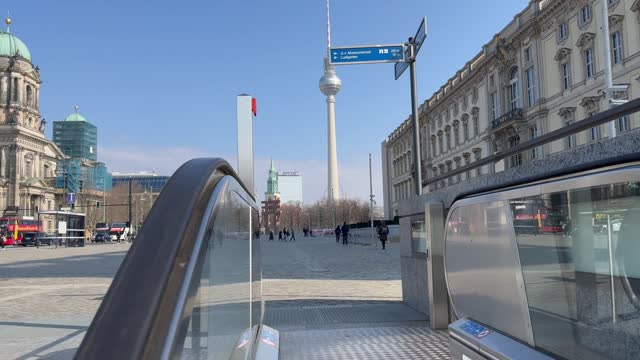 View of the Berlin television tower and the Berlin Cathedral from a moving escalator