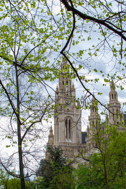 istock View of the City Hall clock tower through the tree branches 2148301326