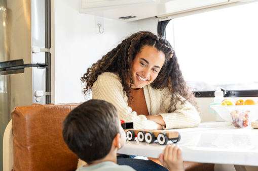 Mom Driving Rv Taking Break In Rv Young Mom Interacts With Preschool Son Stock Photo ...