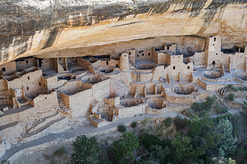 View of the ancient canyon cliff dwelling in Mesa Verde National Park located in the arid southwest desert of Colorado, USA.