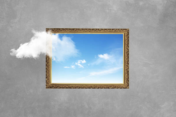 Vintage frame with blue sky on concrete wall. Think outside the box surreal minimal, concept. Creative idea