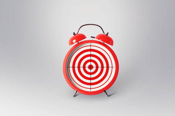 Red retro alarm clock with a target, concept. Creative idea of time and successful goals. Excellent management marketing and successful business.