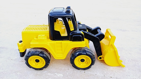 Toy car, toy yellow truck