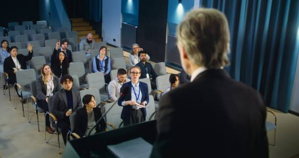 istock Back view of politician or activist pronouncing speech during press campaign 2148303537