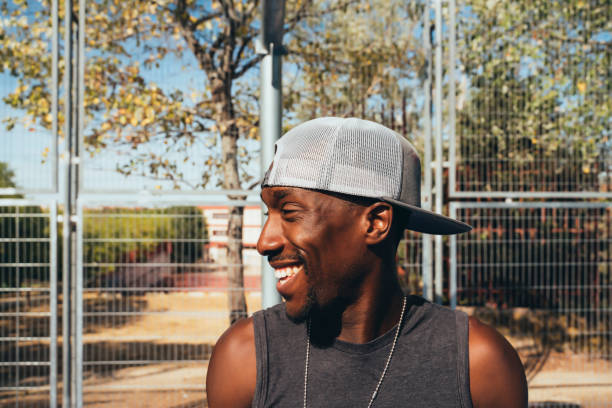 istock African man with cap on the street smiling 2148304154