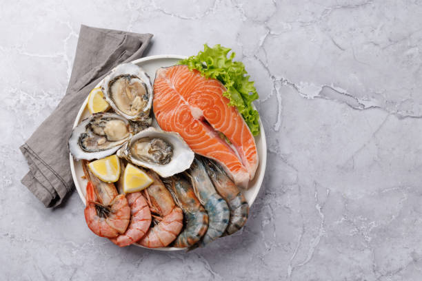 istock Seafood Platter Delight: Shrimps, Salmon, Oysters Galore 2148304655