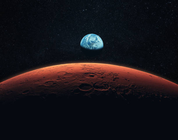 istock Mars, the red planet with detailed surface features and craters in deep space. Blue Earth planet in outer space. mars and earth, concept 2148304699