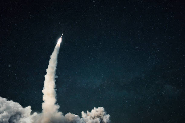 istock Rocket lift off into space. Spaceship launch with smoke on the starry sky. Space and travel wallpaper. Copy space for design and text 2148304876