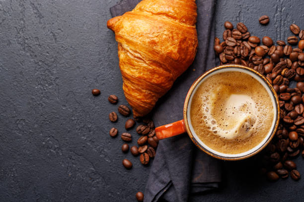 istock Cappuccino coffee and fresh croissant 2148305097