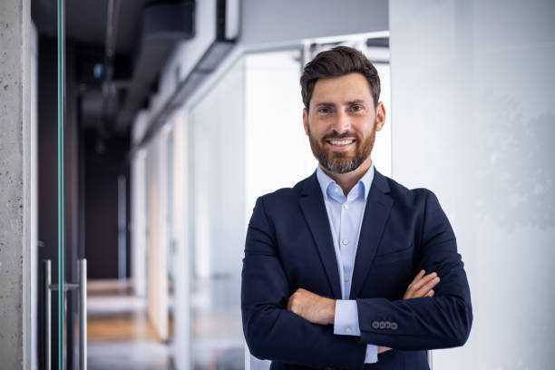 istock Confident smiling businessman in office setting portrait 2148305157