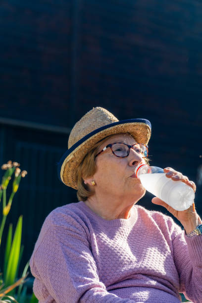istock Active retired woman, drinking and resting in the garden 2148305473