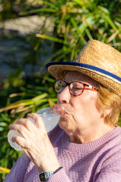 istock Active retired woman, drinking and resting in the garden 2148305474