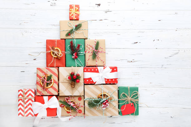 istock Gift boxes with ornaments on white wooden background 2148305662