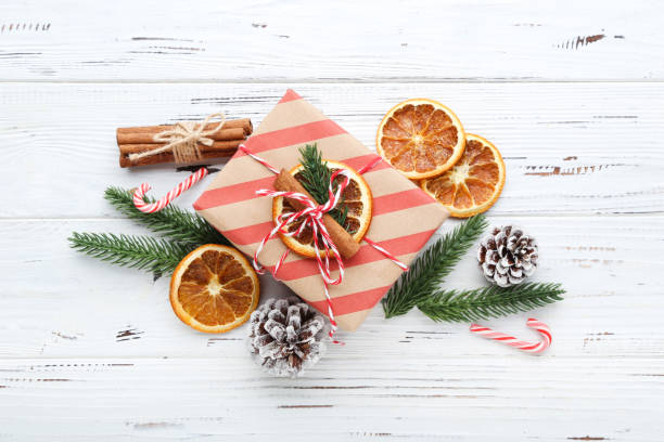 istock Gift box with ornaments on white wooden background 2148306297