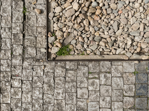 Old cobblestone and stone gravel texture.