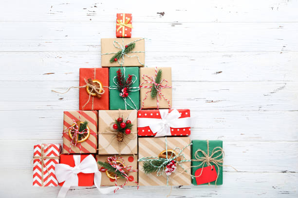 istock Gift boxes with ornaments on white wooden background 2148306649