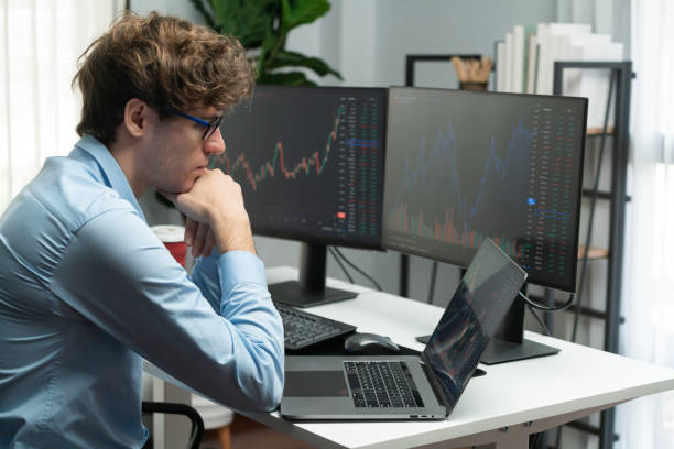istock Working young business trader focusing stock graph on laptop. Gusher. 2148307456
