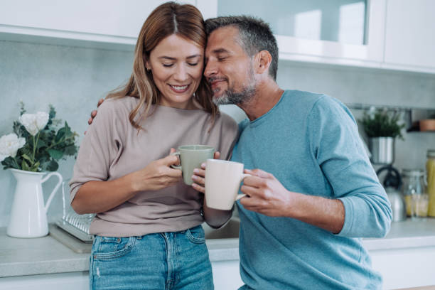 istock Lovely couple drinking coffee at home. 2148308280